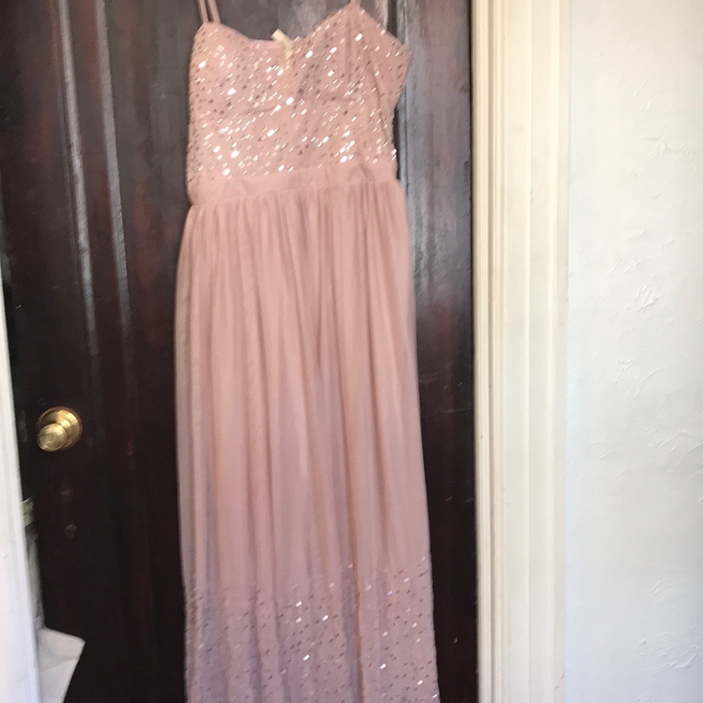 Floor length sequined dress.